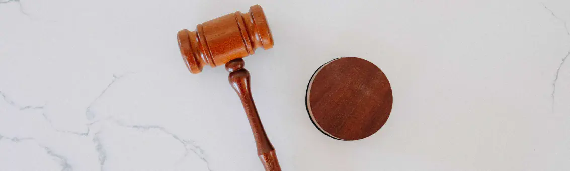 Wooden gavel on marble surface