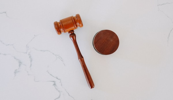 Wooden gavel on marble surface